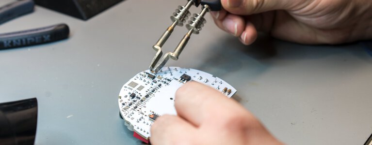 Inserting the circuit board in an emergency light 